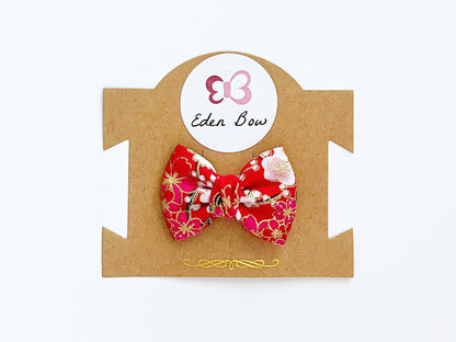 Red sakura prosperity bow
