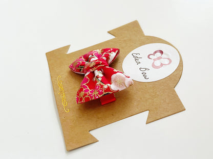 Red sakura prosperity bow